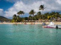 The view as we arrive at Pinel Island. Yes, those lucky bastards are all drinking beers around tables set in the calm waters of the bay! Even though it&#39;s uninhabited there are two restaurants on the island (if I recall correctly)